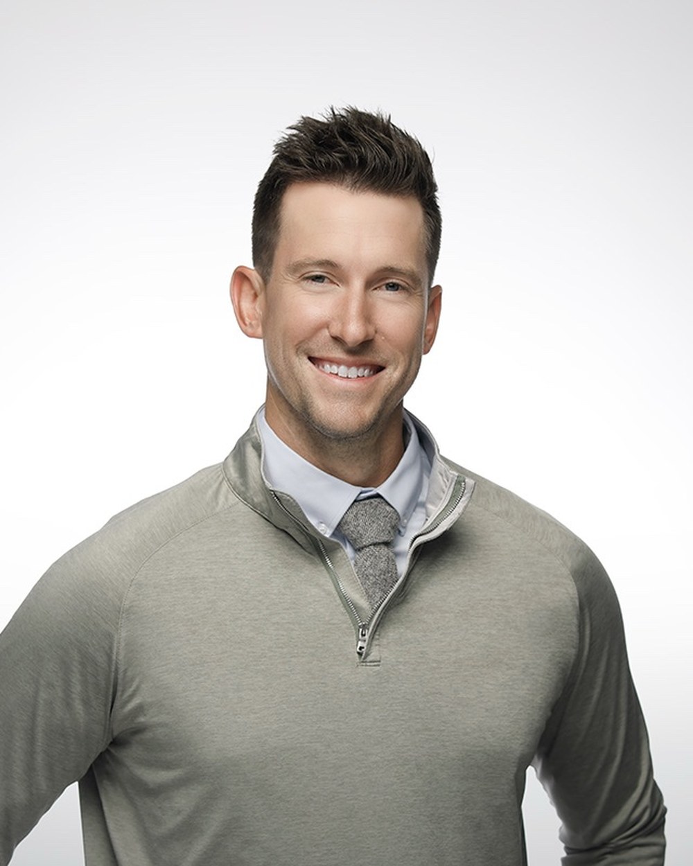 Eric Goddeyne, PA-C, founder of Mobile Therapeutics, in a grey quarter-zip pullover.